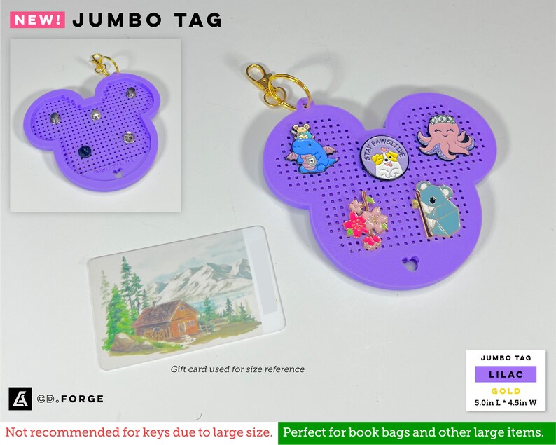 May include: A lilac, Mickey-shaped pegboard display tag with a gold-toned keyring. The tag features a grid of small holes for enamel pins, including a blue dragon, a dog with the text Stay Pawsitive, a pink octopus, flowers, and a koala.