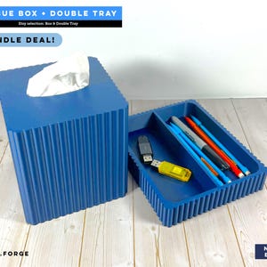 May include: A navy blue tissue box and a matching double tray with a ribbed exterior. The tissue box holds white tissues, and the tray contains pens and USB drives. Text on the image reads: TISSUE BOX + DOUBLE TRAY, BUNDLE DEAL!, CD.FORGE, NAVY BLUE.
