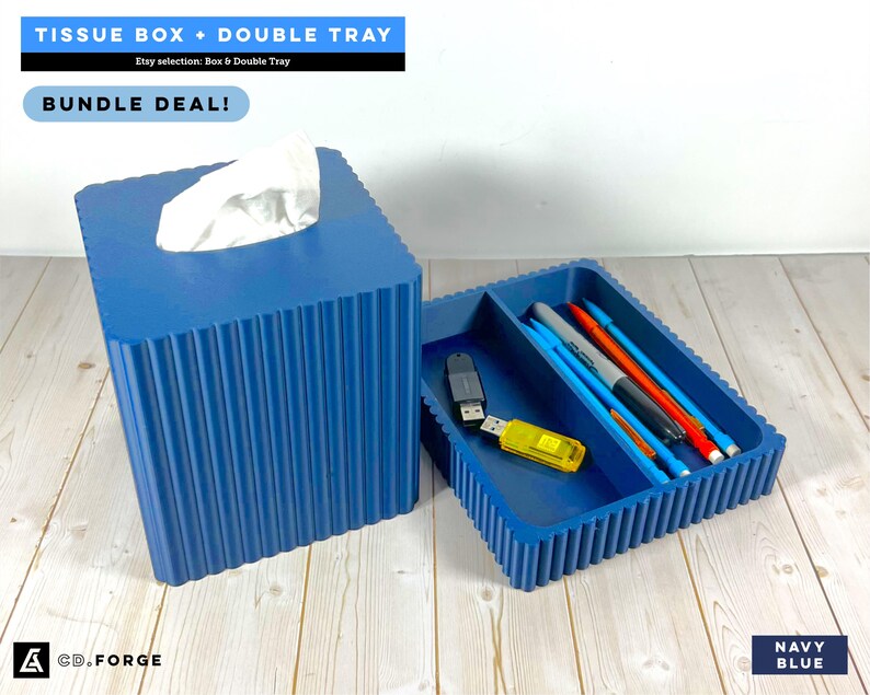 May include: A navy blue tissue box and a matching double tray with a ribbed exterior. The tissue box holds white tissues, and the tray contains pens and USB drives. Text on the image reads: TISSUE BOX + DOUBLE TRAY, BUNDLE DEAL!, CD.FORGE, NAVY BLUE.