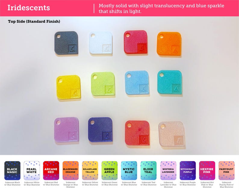 May include: A collection of twelve square-shaped swatches with rounded corners and a circular hole in the top left corner. The swatches are arranged in three rows and feature various colors including black, white, red, orange, yellow, green, blue, teal, lavender, purple, and pink.