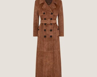 May include: A long, brown suede trench coat with a double-breasted design. It has a notched collar, a matching belt with a square buckle, and black buttons. The coat is a classic style, suitable for various occasions.