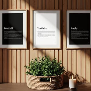 May include: Three framed wall art prints featuring dictionary-style definitions for Football, Vestiaire, and Rugby. The outer prints have black backgrounds with white text, while the centre print has a white background with black text.