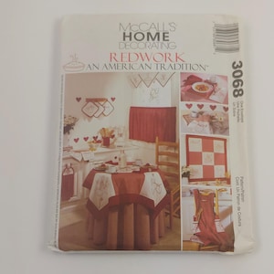 May include: A vintage McCall's Home Decorating pattern for redwork embroidery. The pattern includes instructions for a tablecloth, placemats, a valance, and a quilt. The pattern is titled "Redwork: An American Tradition" and the pattern number is 3068.