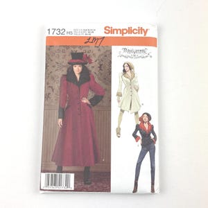 May include: Simplicity sewing pattern 1732 H5, featuring a long red coat with black trim and a matching hat. The pattern includes illustrations of different coat styles. The size range is US 6-8-10-12-14.