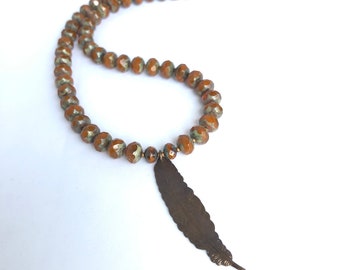 feather pendant. brown Czech glass bead jewelry. natural brass ooak handmade necklace by CURRICULUM