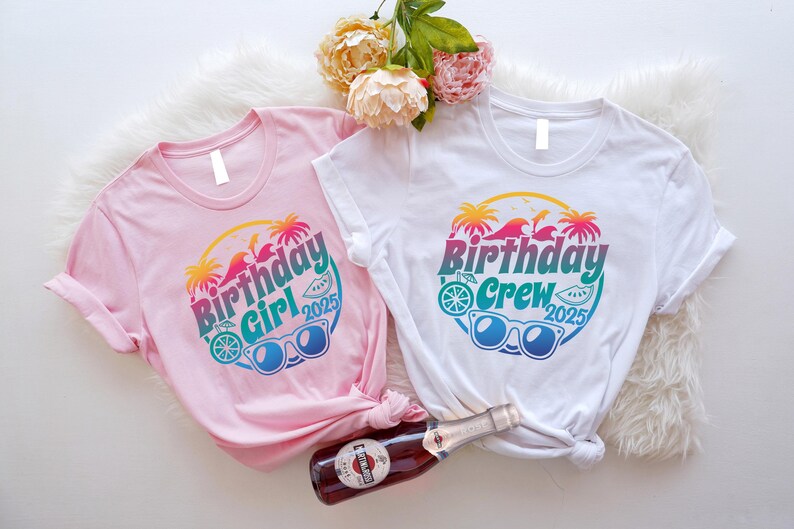 May include: Two short-sleeved t-shirts, one pink and one white, with a colorful graphic that reads "Birthday Girl 2025" and "Birthday Crew 2025". The design includes sunglasses, palm trees, and a slice of watermelon. A bottle of sparkling wine is in the image.