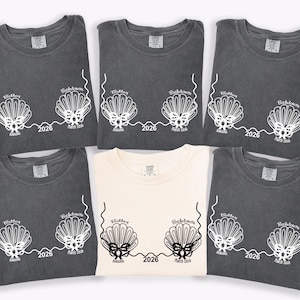 May include: A handmade, wooden serving tray with a natural finish. The tray features a rectangular shape with rounded corners and two carved handles. The wood grain is visible, adding to its rustic charm. Dimensions are approximately 16 inches long and 10 inches wide.