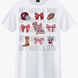 May include: White t-shirt featuring various watercolor illustrations, including a football helmet, bows, a football, a cowboy boot, and an elephant. The text "Roll Tide" is in the center. The text "KK'S SHIRTS & MORE" is repeated throughout the design.