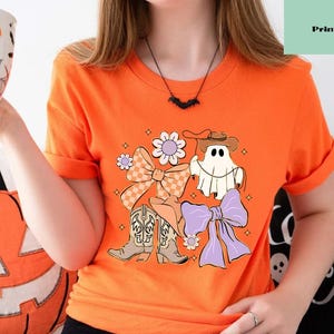 Ghost Cowgirl Halloween T-Shirt: Western Floral Pumpkin Tee