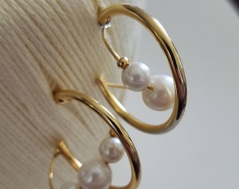 Chic swirling golden pearl accented hoops