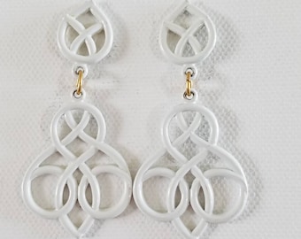 Graphic white enamel knot dangle post earring