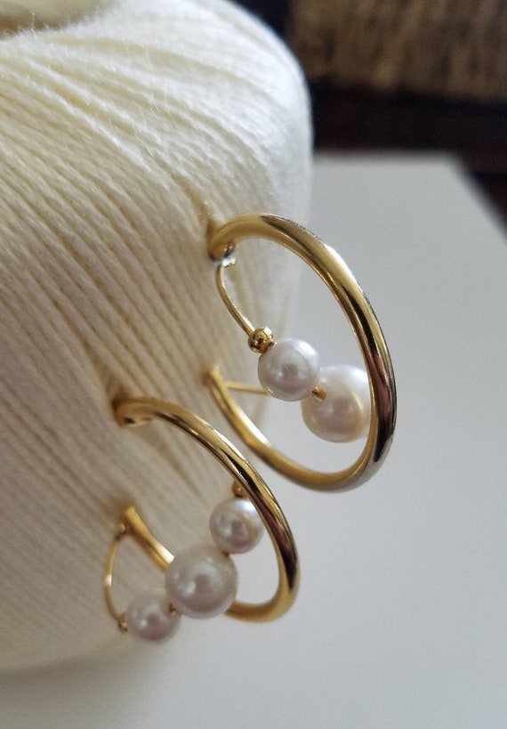 Chic swirling golden pearl accented hoops