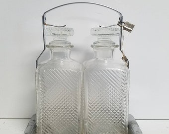 Locked Twin Molded Glass Decanters with Carrier. A tantalizing tantalus!