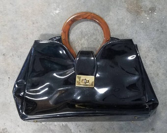 Patent leather acrylic handled midcentury handbag