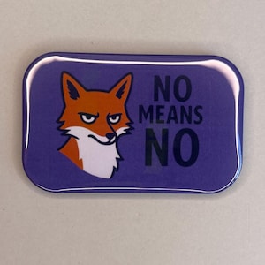 May include: A rectangular purple button with rounded corners. It features a cartoon fox with orange fur and a white face, and the text "NO MEANS NO" in black letters.