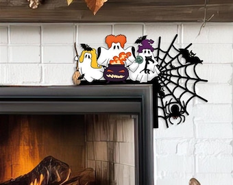 May include: A Halloween decoration made of wood, featuring three cartoon ghosts, a cauldron with flames, and a spider web with spiders. The ghosts have orange, yellow, and purple accents. The spider web is black.