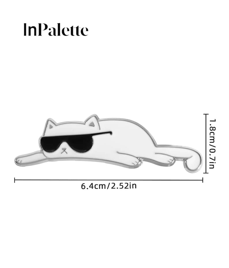 May include: A white cat-shaped pin with black sunglasses, measuring 6.4cm long and 1.8cm high. The pin has a silver outline and is in a relaxed pose. The text "InPalette" is at the top.