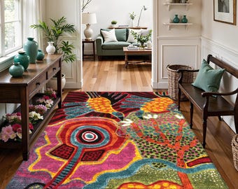 May include: A vibrant, abstract area rug with a colorful design. The rug features a mix of red, pink, orange, blue, and green hues. The design includes stylized floral and geometric shapes, creating a bold and artistic statement for any room.