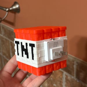 Mini TNT Minecraft-inspired plug in night light for kids or gaming enthusiasts!