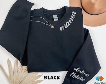 May include: Black sweatshirt with the word "mama" embroidered on the front and the names "Andrew" and "Natalie" embroidered on the sleeves.