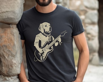 May include: Black t-shirt featuring a beige illustration of a dog playing an electric guitar. The dog is wearing a necklace. The t-shirt has short sleeves and a crew neck. The design has a distressed, vintage look.