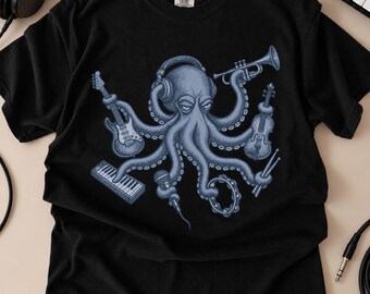 May include: A black t-shirt featuring a graphic of a blue octopus wearing headphones. The octopus is holding a guitar, a trumpet, a violin, a keyboard, a microphone, a tambourine, and drumsticks in its tentacles. The shirt has a crew neck.