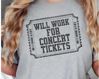 May include: A gray t-shirt with the text "WILL WORK FOR CONCERT TICKETS" printed in a black ticket-shaped design. The shirt is short-sleeved and made of a soft material.