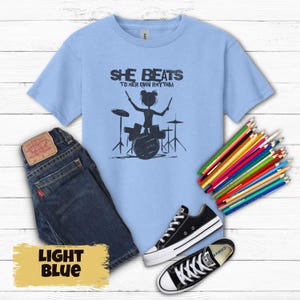 Girls Drummer Tee, She Beats To Her Own Rhythm Kids T-Shirt, Girl Power Music Gift, Children&#39;s Musician Graphic Shirt, Youth Drumming Gift