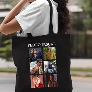 May include: Black tote bag featuring a collage of images of Pedro Pascal. The name "PEDRO PASCAL" is printed in white at the top. The word "Black" is printed in white at the bottom right corner.
