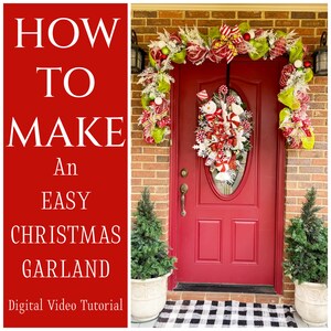 May include: How to make an easy Christmas garland. A red front door with a wreath and garland decorated with red, white, and green. The garland is made of mesh and has a snowman design.