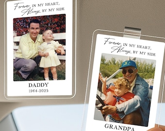 May include: Two clear car visor photo holders with family photos. One says "DADDY 1964-2025" and the other says "GRANDPA 1939-2025". Both have the text "Forever, IN MY HEART, Always BY MY SIDE" at the top.