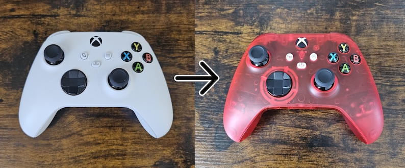 May include: An Xbox controller in white and a transparent red. The white controller has black joysticks and buttons with colored letters. The red controller has black joysticks and buttons with colored letters. The controllers are on a wooden surface.