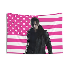 May include: A rectangular tapestry featuring a man in a black leather jacket against a pink and white American flag design. The flag has white stars in the upper left corner and pink and white stripes.