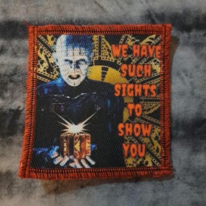 May include: A white ceramic mug with a black handle and the text "But First, Coffee" in a bold, black font. The mug is set against a neutral background, highlighting its simple design.