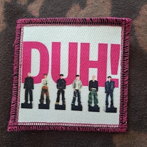 May include: A rustic wooden sign with the text "Welcome to our home" in white lettering. The sign features a distressed finish and a simple, inviting design, perfect for front door decor.