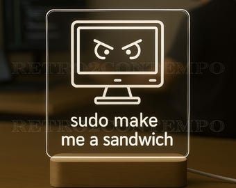 May include: A lighted desktop computer-shaped sign with the text "sudo make me a sandwich". The sign has a wooden base and a white outline of a computer monitor with angry eyes.