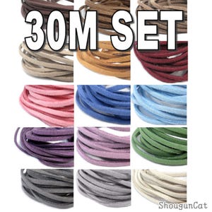 May include: A 30M SET of flat suede leather cords arranged in a grid of twelve distinct colors including brown, tan, burgundy, pink, blue, light blue, purple, lavender, green, dark gray, light gray, and cream, each coiled into a circular shape.