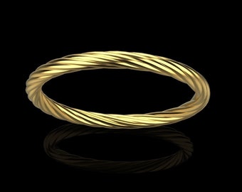 May include: A gold-colored twisted ring with a smooth, polished finish.