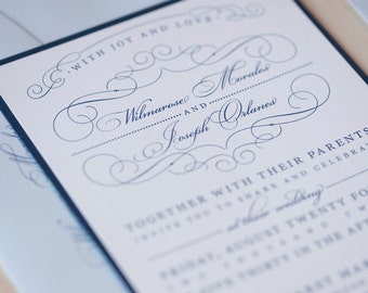 Puede incluir: Una invitación de boda blanca con caligrafía azul marino. La invitación dice: "Con alegría y amor, Wilmarose Morales y Joseph Orlanes, junto con sus padres, les invitan a compartir y celebrar su boda el veinticuatro de agosto de dos mil veintitrés a las seis y media de la tarde. "