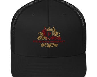 May include: Black trucker hat with a mesh back and a curved brim. The front features an embroidered crest with the letter "P" and the words "PEELED BACK UNIVERSITY" in red and gold.