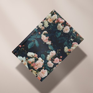 May include: A dark blue notebook cover with a floral pattern featuring pink and white roses and green leaves.