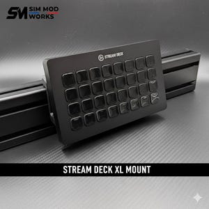 May include: A black Stream Deck XL mount with multiple square buttons. The mount is attached to a black metal frame. The text "STREAM DECK XL MOUNT" is displayed at the bottom of the image.