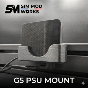 May include: A black G5 PSU mount with the text "G5 PSU MOUNT" at the bottom. The mount is attached to a surface and has a textured front. The logo "SIM MOD WORKS" is at the top left.