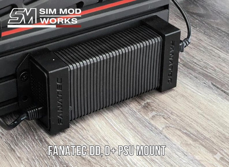 May include: Black Fanatec DD, D+ PSU mount. The mount is rectangular with vertical ridges and the Fanatec logo on the side. The text "FANATEC DD, D+ PSU MOUNT" is at the bottom of the image.