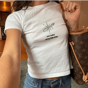 you make skz stay- stray graphic baby tee - hyunji.n feli.x bang cha top - Subtle kpop T-Shirt - hop ate giant rock-star Fan Gift image 1
