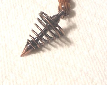 Magical pendulum, wood beads, spiral focal. 8 inches long. 112