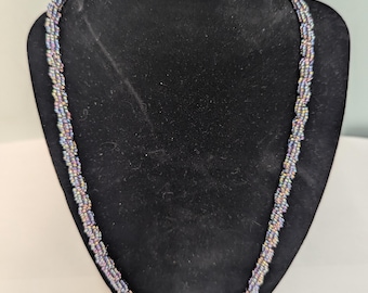 Handmade glass bead necklace, purple iris beads around a translucent bead. 24009