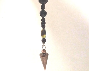 Magical pendulum, brass color focal, acrylic and stone beads. 8 inches long. 117