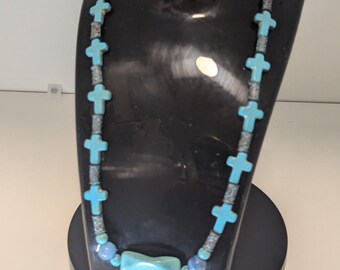 Beaded necklace with crosses and metal beads. 126