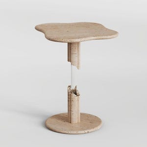 May include: A side table featuring a beige, porous stone top with an irregular, organic shape. The central support column is composed of two matching stone segments separated by a clear, transparent acrylic rod, resting on a circular stone base.